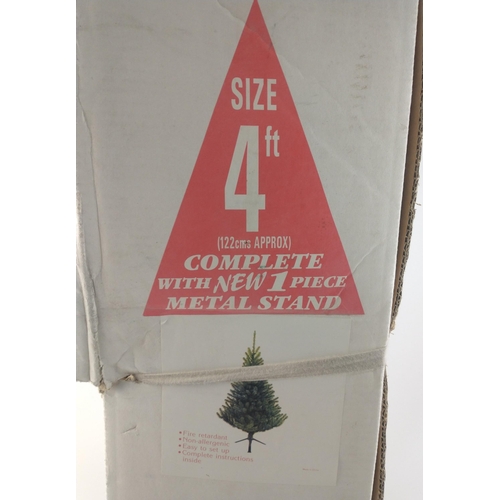 493 - A 4ft Christmas tree on stand. Boxed in good condition.#496