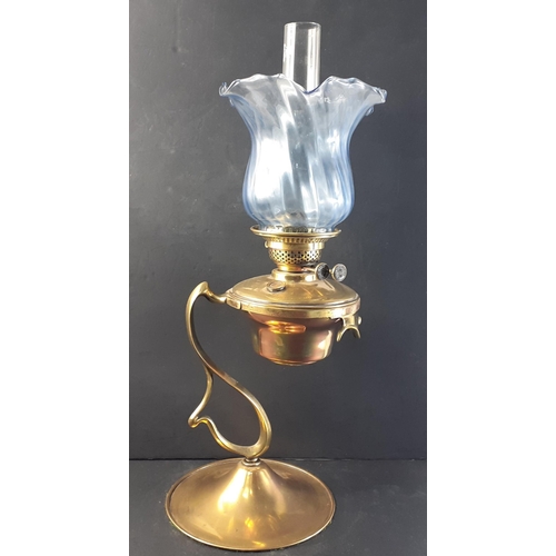 197 - Stunning brass oil burner table lamp with unusual design, chimney and blue glass shade. Burner marke... 