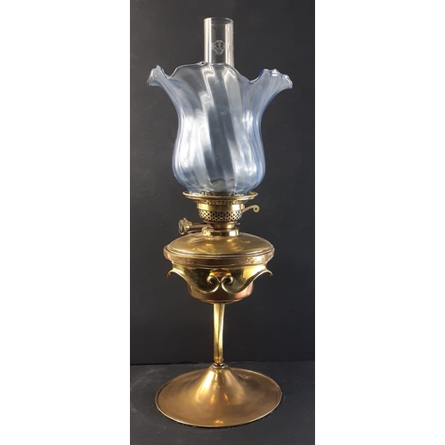 197 - Stunning brass oil burner table lamp with unusual design, chimney and blue glass shade. Burner marke... 