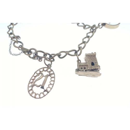 24 - A 9k stamped yellow gold charm bracelet with 4 charms, two hallmarked 375 other 2 unmarked. Charms i... 