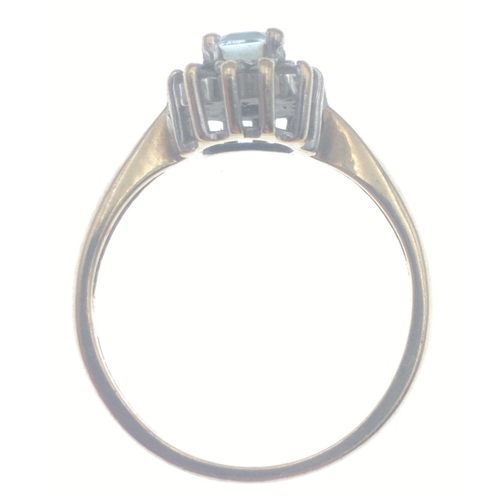 25 - A 9ct hallmarked yellow gold ring set with clear stone surrounded by diamond chips. Size O and gross... 