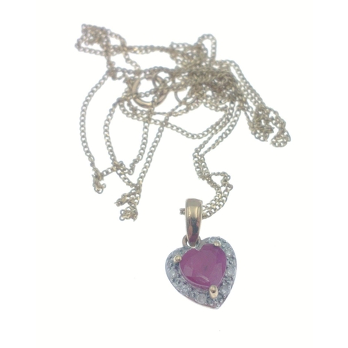 31 - Great gift for Valentines, a 375 hallmarked heart pendant set with red stone surrounded by diamond (... 