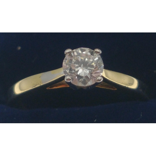 35C - A lovely 750 stamped 18ct gold ring with lovely centre diamond (tested) 5mm approx (0.5 carat approx... 