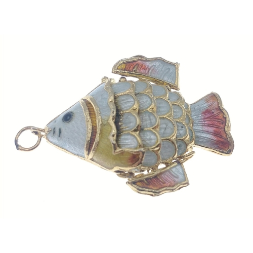 38A - A pretty articulated Fish pendant.  Finish in attractive gilt and enamel it measures 4cm approx. A v... 