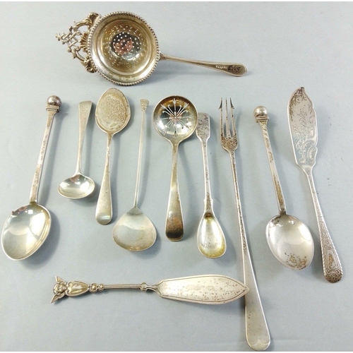 59 - A small silver collection to include  pickle forks, tea strainer, spoons etc.  A super little lot.  ... 