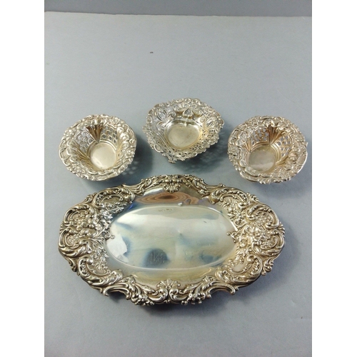 61 - A repousse silver tray (17cm approx), and 3 other small pierced trays.  Combined weight 105g approx#... 