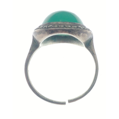 122B - An 835 stamped silver ring with substantial green centre stone with marcasite surround. Size M, gros... 