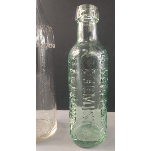 187 - NOBLE'S of GALASHIELS. Two vintage glass bottles, embossed with Noble's name.  The largest with stop... 