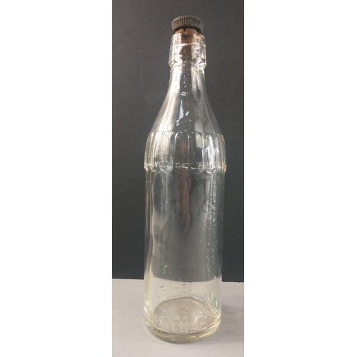 187 - NOBLE'S of GALASHIELS. Two vintage glass bottles, embossed with Noble's name.  The largest with stop... 