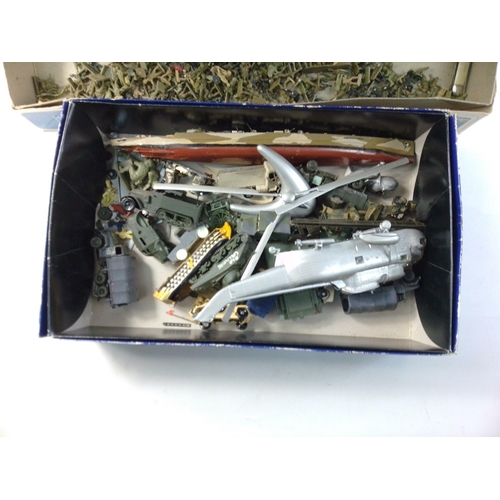 220 - A box containing assorted plastic toy soldiers, some models, WADE whimsies and others.  All with wea... 