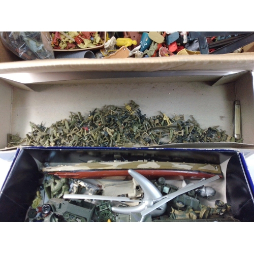 220 - A box containing assorted plastic toy soldiers, some models, WADE whimsies and others.  All with wea... 