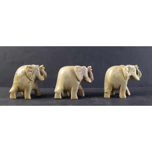 229 - Three wonderful small green soapstone elephant figures. Each approx 5cm tall and in nice condition.#... 