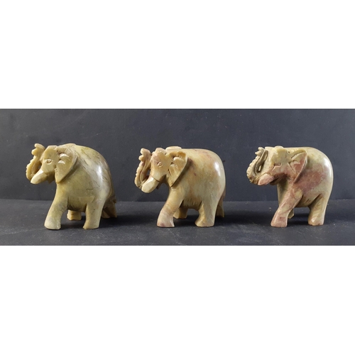 229 - Three wonderful small green soapstone elephant figures. Each approx 5cm tall and in nice condition.#... 