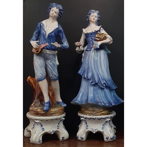 241 - Two VERY TALL CAPODIMONTE pottery figures on stands to include a young man with a mandolin (small pi... 