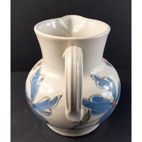 255 - A BUCHAN of Portobello jug (18cm tall) with attractive floral colourway and with some light hairline... 