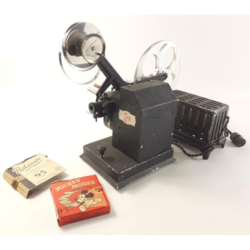 349 - RARE ASTOR pathescope vintage projector includes some vintage reels including Mickey Mouse 