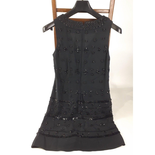 384 - A fully lined black FRENCH CONNECTION sleeveless dress UK size 10 decorated with black beading.#136... 