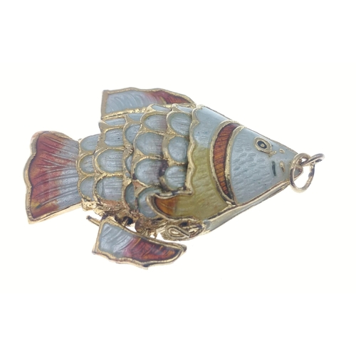 38A - A pretty articulated Fish pendant.  Finish in attractive gilt and enamel it measures 4cm approx. A v... 