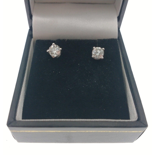 11 - 18ct (750 stamped) Yellow and white gold earrings each set with a single round brilliant cut diamond... 