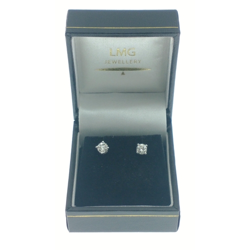 11 - 18ct (750 stamped) Yellow and white gold earrings each set with a single round brilliant cut diamond... 