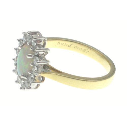 12 - Hand made 18ct yellow and white gold opal and diamond cluster ring set with one centre opal approx 0... 