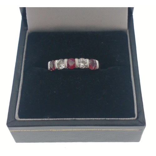 13 - Stunning Ruby and Diamond ring. Yellow and white gold bar set five stone ring comprising three rubie... 