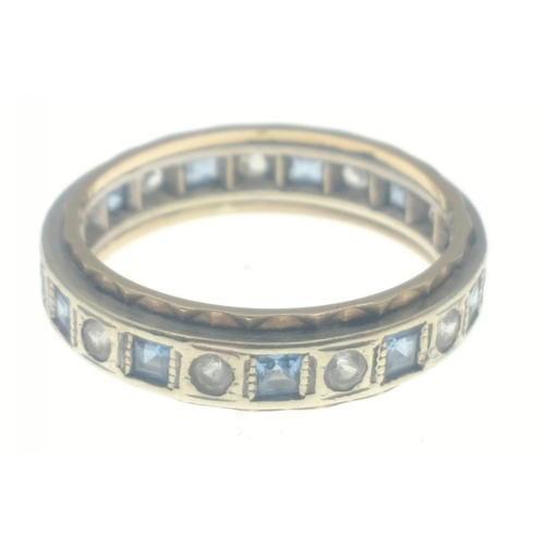 15B - Ladies eternity ring stamped 375, set with alternating blue and clear stones, size O, gross weight 3... 