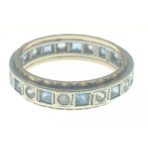 15B - Ladies eternity ring stamped 375, set with alternating blue and clear stones, size O, gross weight 3... 