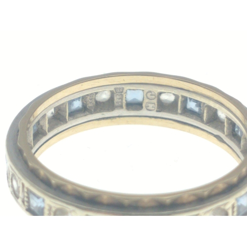 15B - Ladies eternity ring stamped 375, set with alternating blue and clear stones, size O, gross weight 3... 