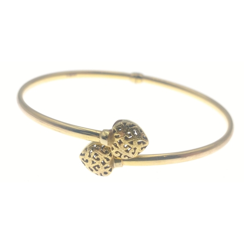 15D - A gold bangle stamped 375 Italy, with heart-shaped ends.  Weighs 4.78g approx#19