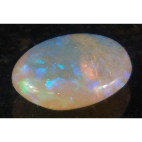 15J - OPULENT OPAL stone - An oval cut rainbow COOPER PEDY opal gifted to the vendor on his birthday in 19... 