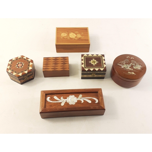 203 - Six wooden trinket boxes each decorated with marquetry or mother of pearl.  Lovely decorative object... 