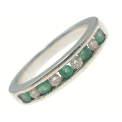 3 - An 18k stamped diamond & emerald ring with 5 emeralds interspersed with four diamonds. Size J. G... 