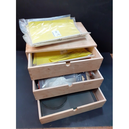 384 - A cabinet maker's handmade small drawer set with 3 drawers to include contents sheets of sandpaper, ... 