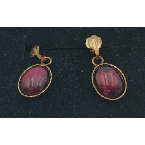 8 - A pair of lovely 9ct stamped earrings with red centre stones.  A very pretty pair. 1.1g gross weight... 