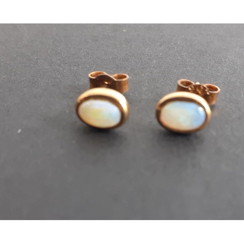 9 - A pair of stunning little 9ct gold stamped earrings with attractive opal centres. Gross weight 0.9g ... 