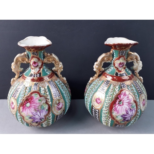 180 - ANTIQUE - A rather pretty pair of highly decorated antique urn vases with gilt highlights.  Each 14c... 