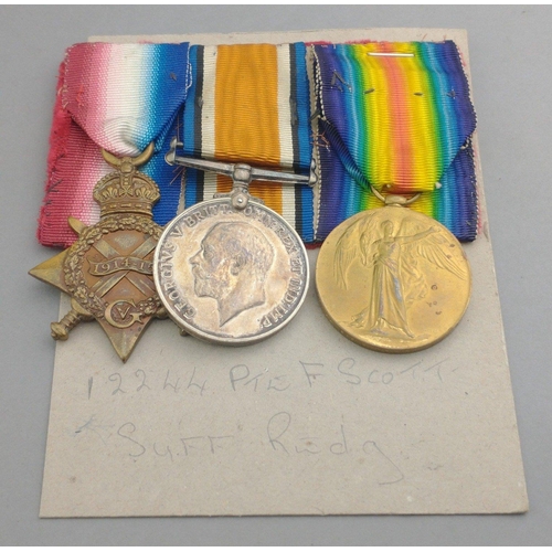 170 - WWI medal trio SUFFOLK REGIMENT awarded to 12244 Pte. F. Scott comprising 1914-15 Star, British War ... 