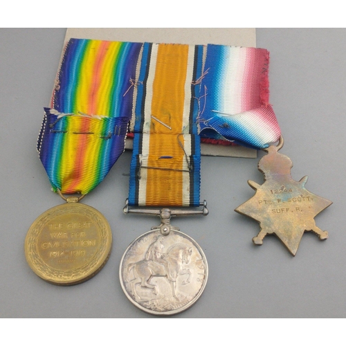 170 - WWI medal trio SUFFOLK REGIMENT awarded to 12244 Pte. F. Scott comprising 1914-15 Star, British War ... 