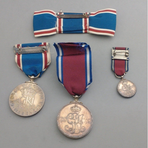 328 - A box containing two 1937 Coronation Medals, a miniature and bow#339