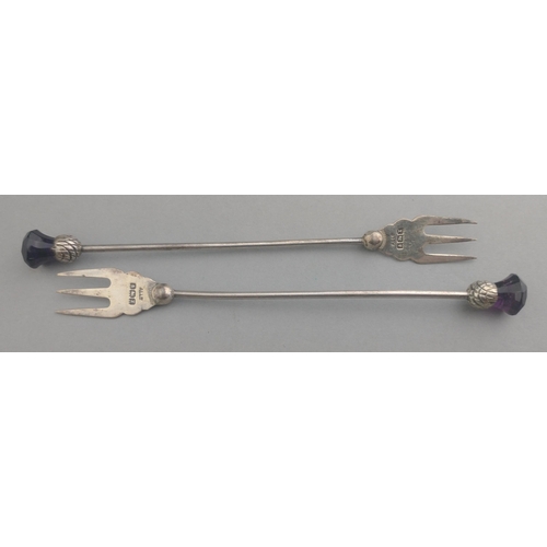 45 - Two beautiful hallmarked silver pickle forks with thistle and purple stone finials 12cm 9.9g approx.... 