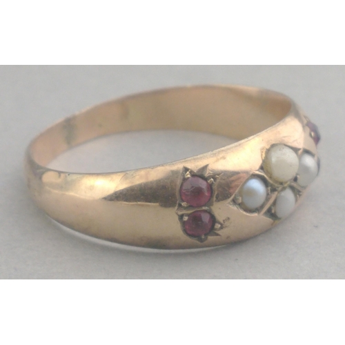 5 - Pretty 9ct stamped gold ring set with red stones and seed pearls. Has been resized. Size Q, gross we... 