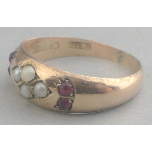 5 - Pretty 9ct stamped gold ring set with red stones and seed pearls. Has been resized. Size Q, gross we... 