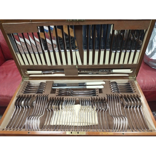 54 - A vintage canteen of cutlery on legs, top quality silver plate, 93 pieces in total.  Knives are etch... 