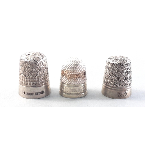 111 - Three thimbles to include one Birmingham hallmarked size 3, one CHARLES HORNER DORCAS size 8 and one... 