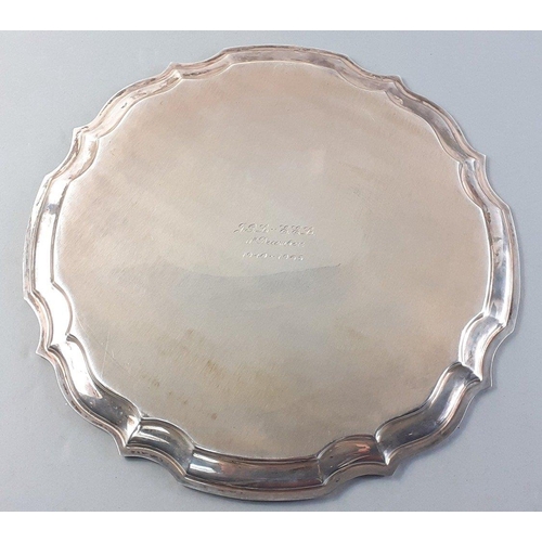 112 - A silver salver hallmarked Birmingham 1987 made by D & F.  Diameter 25cm.  Weight 374g approx#11... 