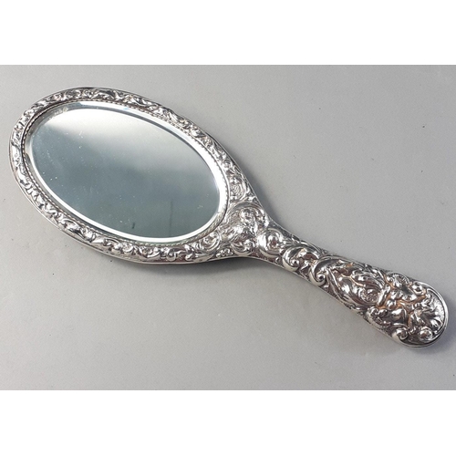 118 - A silver hallmarked dressing table hand mirror by W G Keight hallmarked Birmingham 1904. 25cm long a... 