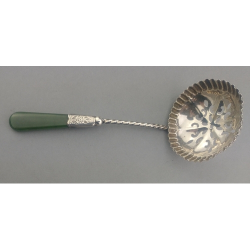 122 - Small silver strainer with jade handle. Hallmarked Birmingham 1904. 12cm approx. Gross weight 15.7g ... 