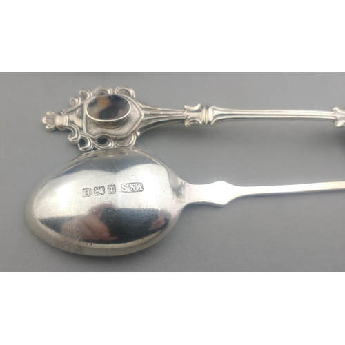 124 - A small collection of silver spoons. Gross weight 65g approx. Also a small pot with shells in.#124... 