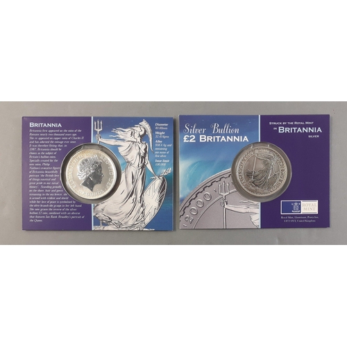 129 - Two Silver Bullion £2 BRITANNIAS in Royal Mint packs both from year 2000.#129